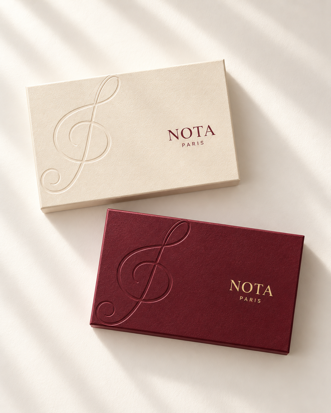 Closed ivory discovery set and burgundy sample set.