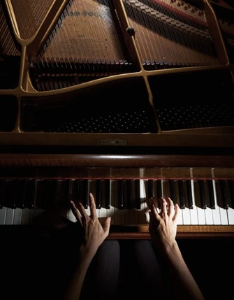 A pianist at a grand piano.